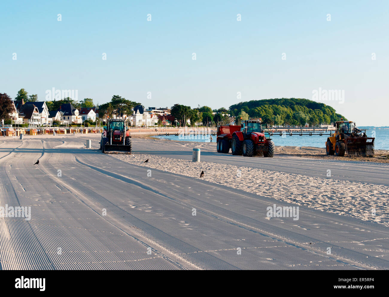 Tractors cleaning the beach, Travemuende, Luebeck, Schleswig-Holstein, Germany Stock Photo