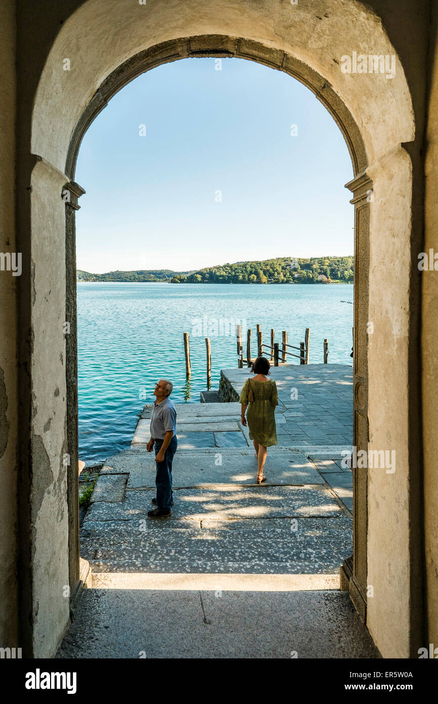 View through a archway to Lake Orta, Isola San Giulio, Piedmont, Italy Stock Photo
