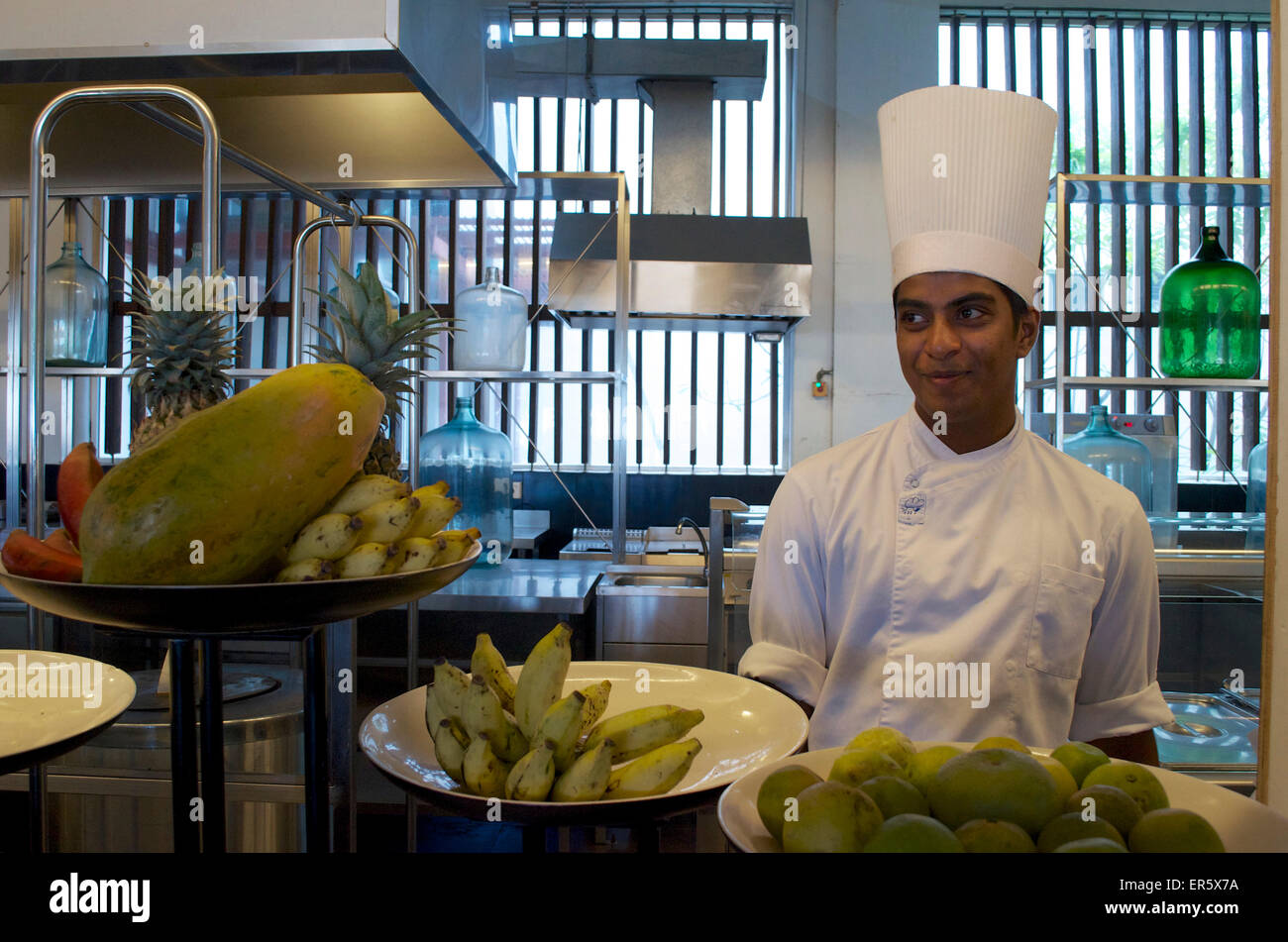 Fruit on the counter and cook in the kitchen of Hotel Jetwing Blue, Negombo, West coast, Sri Lanka Stock Photo