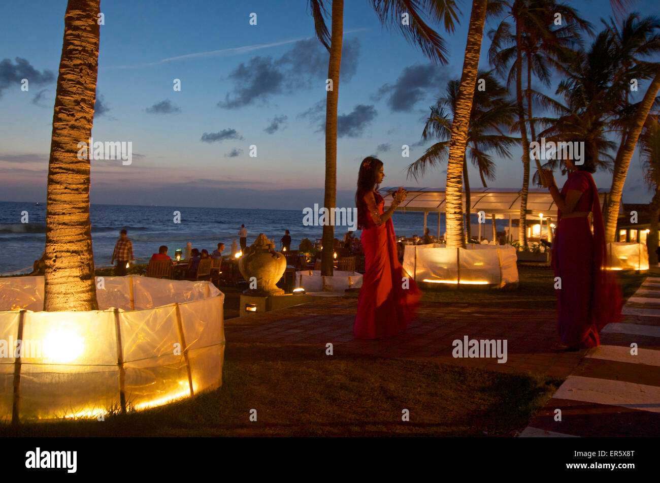 Visitors in the Poolside Bar and Terrace at the Galle Face Hotel, Colombo, Sri Lanka Stock Photo