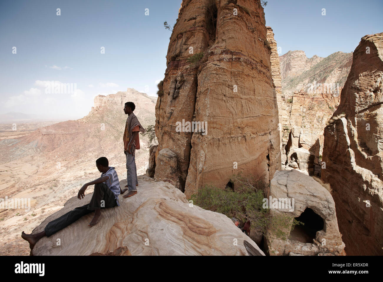 Priest students on a rock, monolithic church Abuna Yemata Guh, Hawzien, Tigray Region, Ethiopia Stock Photo