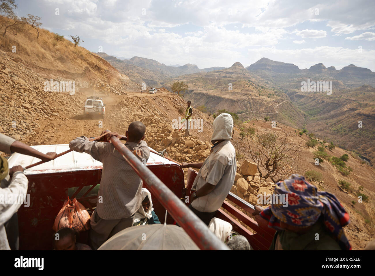 Passengers on the loading area of a truck, road construction zone, near Adi Ar Kay, Amhara region, Ethiopia Stock Photo