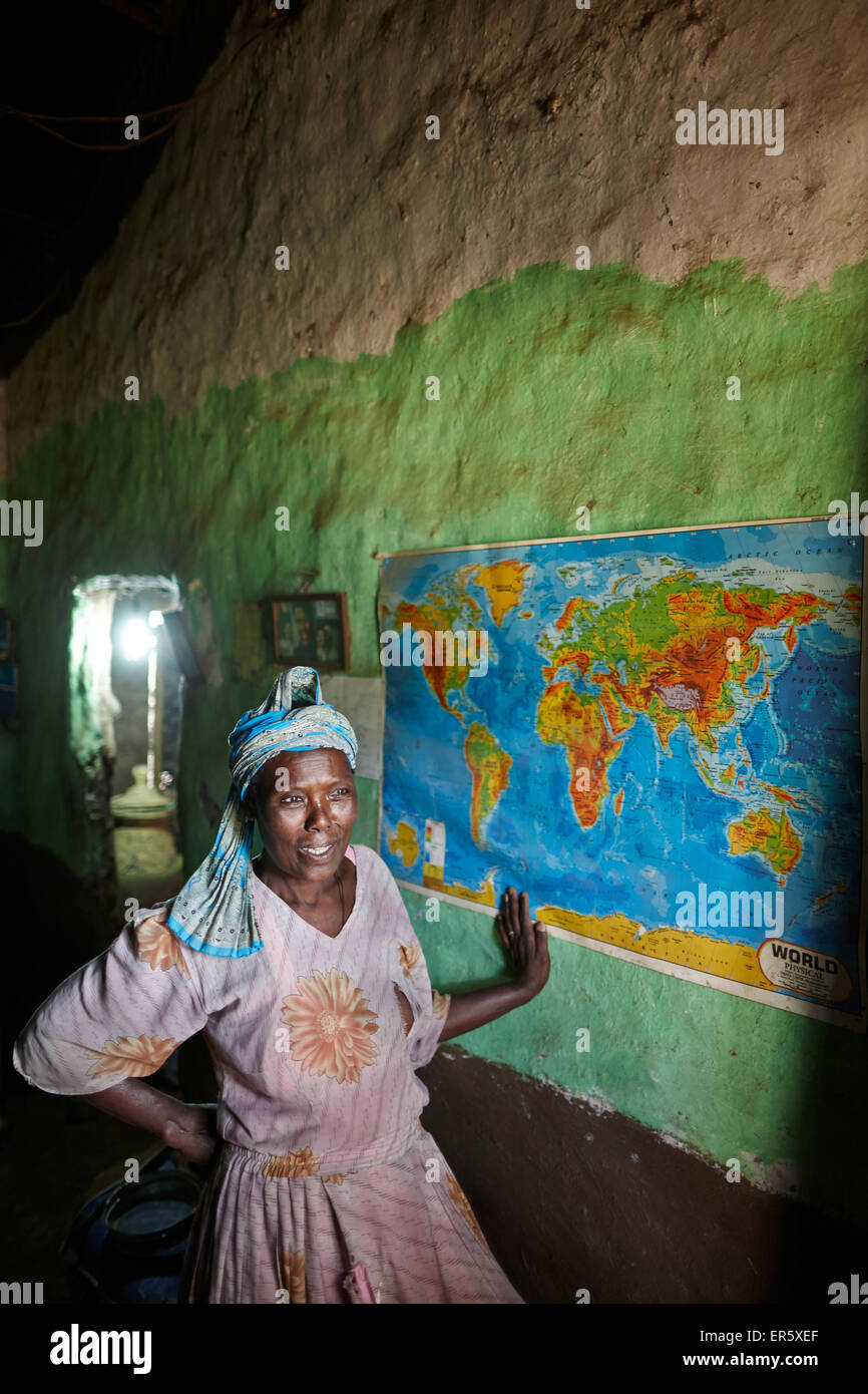 Ethiopian Jewish woman in front of a world map, Walaka, Amhare region, Ethiopia Stock Photo