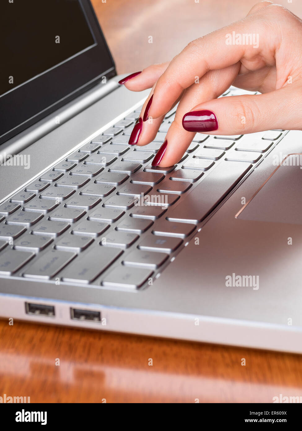 Hand of the woman typing on computer Stock Photo