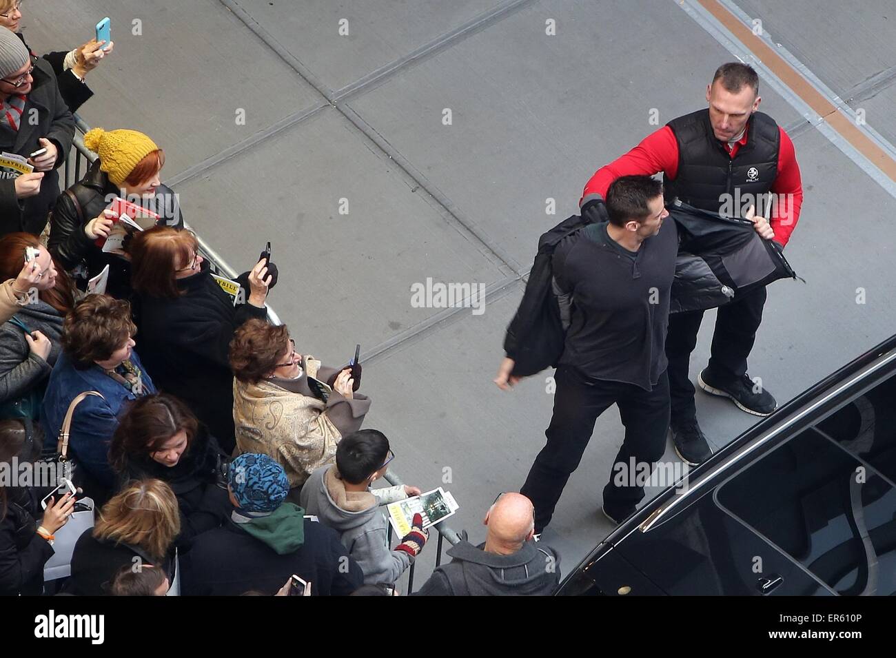 Hugh Jackman meets waiting fans as he leaves the Circle in the Square