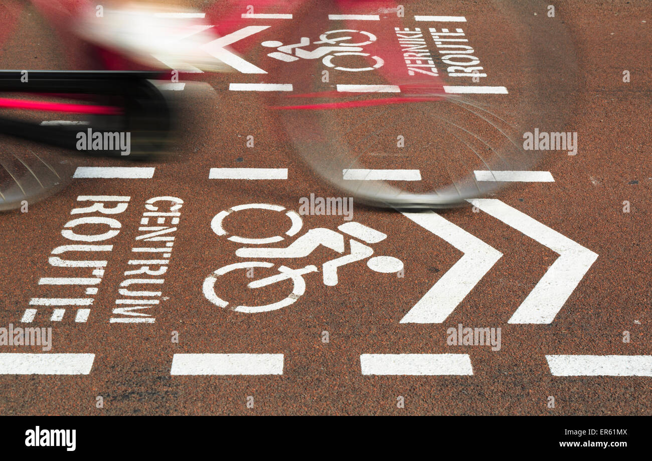 Bicycle riding over a bicycle sign for the city center on a bicycle ...