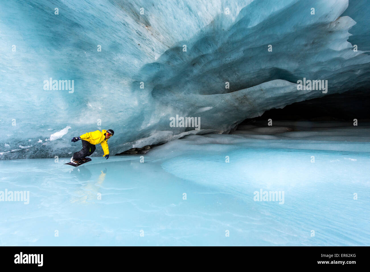 Snowboarding in the ice cave, Val Roseg, Pontresina, Canton of Graubünden, Switzerland Stock Photo