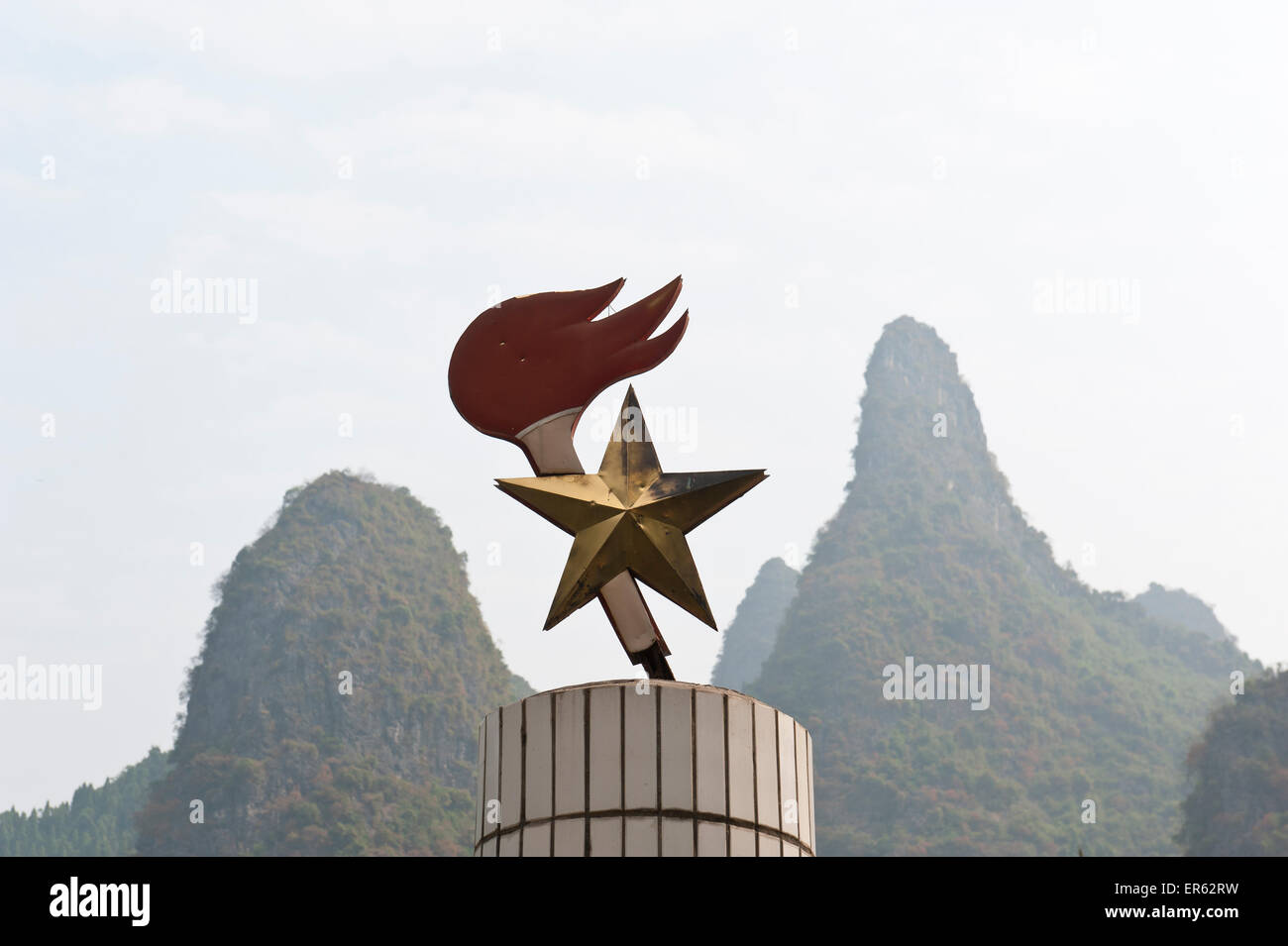 Communist symbol, star and torch, karst mountains, Li River, Li Jiang, Yangdi Town, Yangshuo, near Guilin Stock Photo