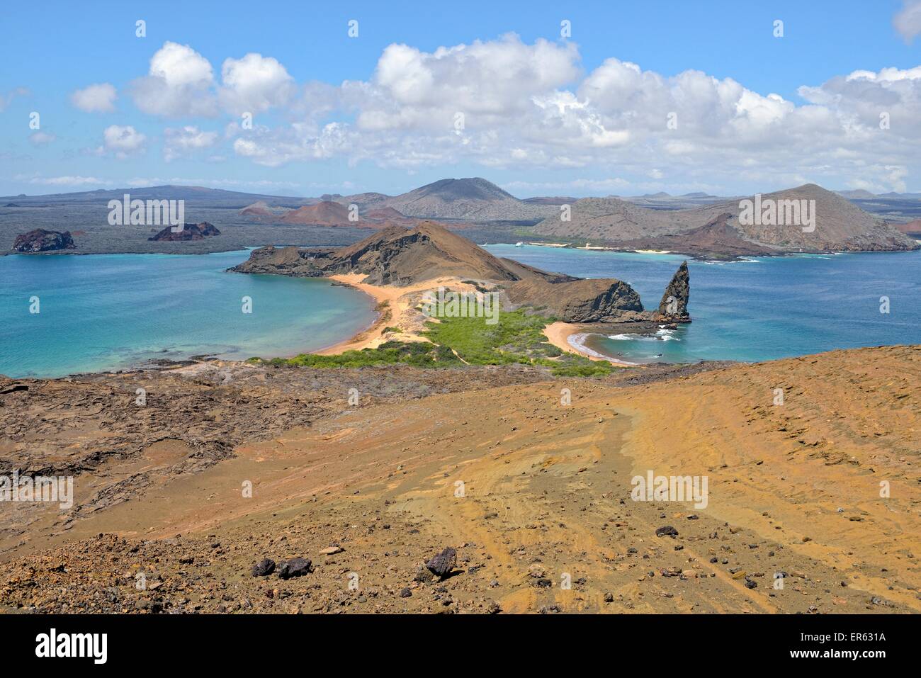 Bartolomé Island, western peninsula with Pinnacle Rock, Santiago Island, also San Salvador Island, behind, Galapagos Province Stock Photo