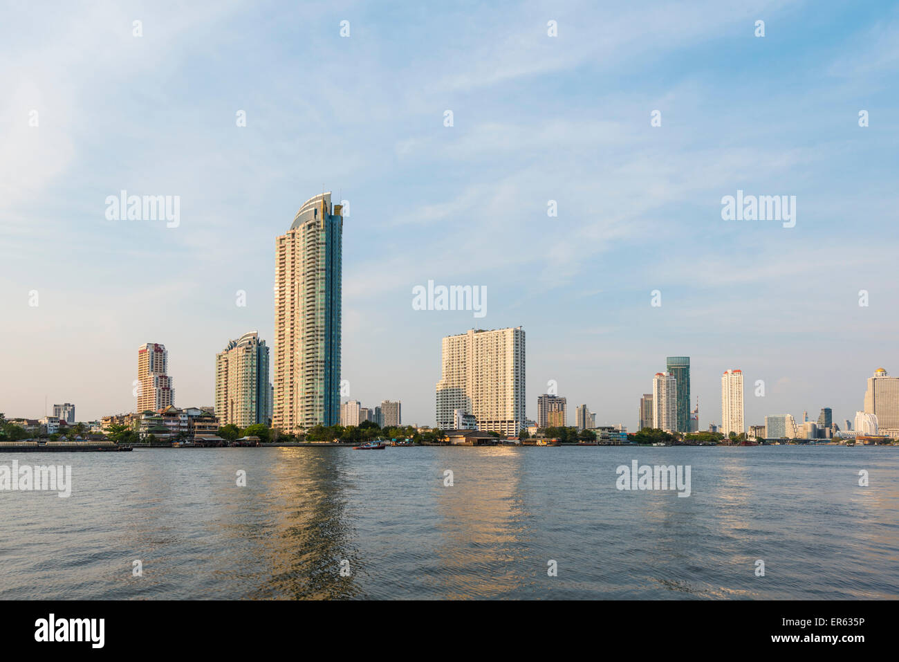 River Mae Nam Chao Phraya with skyscrapers, Bangkok, Thailand Stock Photo