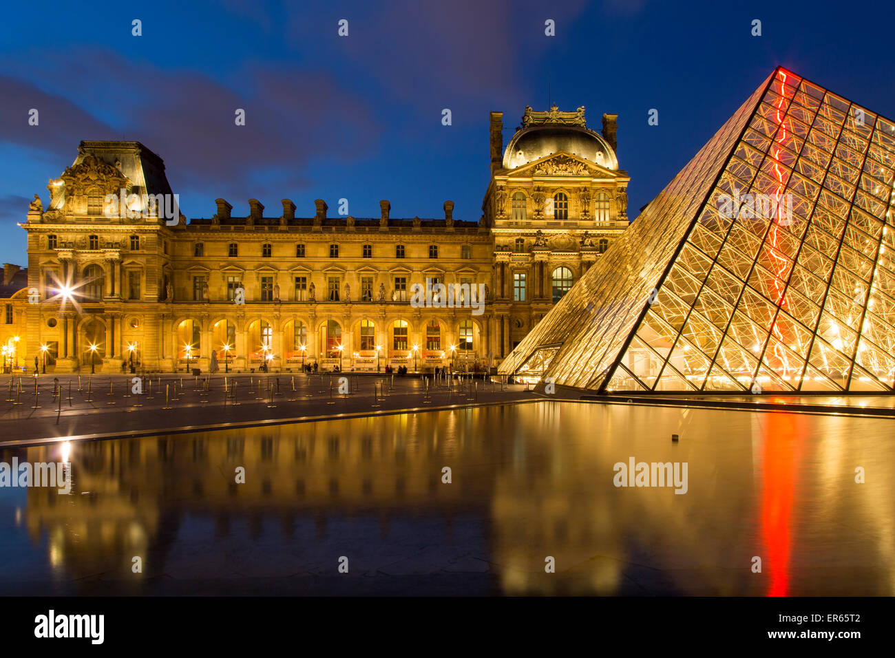 Twilight in the courtyard of Musee du Louvre, Paris, France Stock Photo