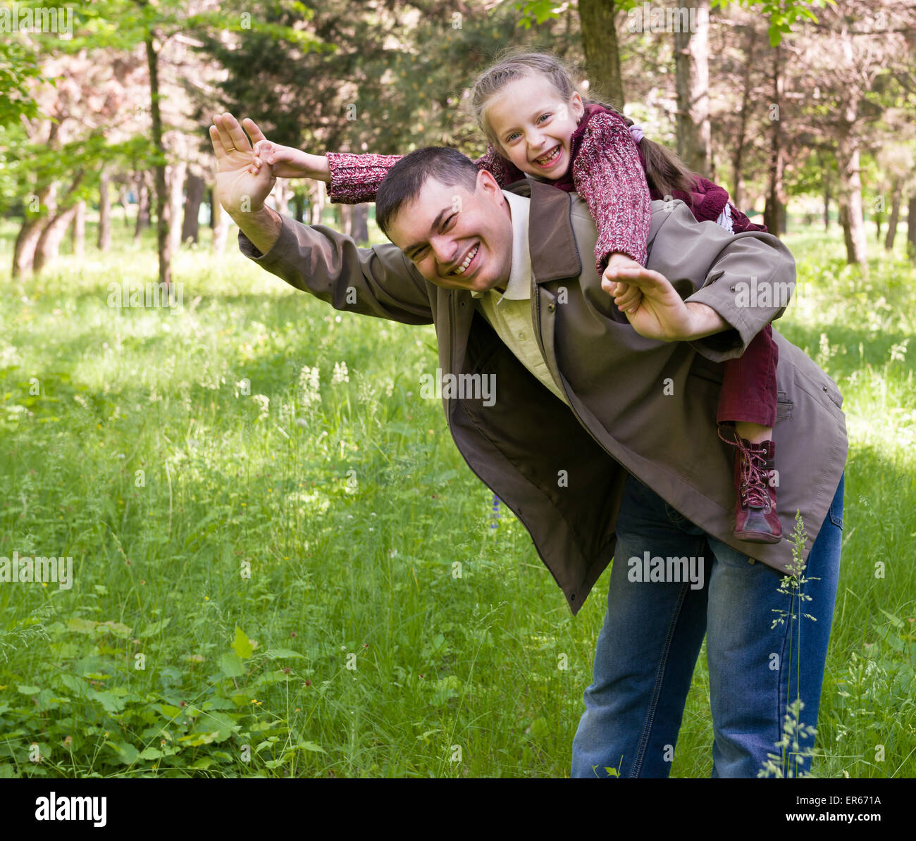 Father and daughter in the park at spring Stock Photo - Alamy