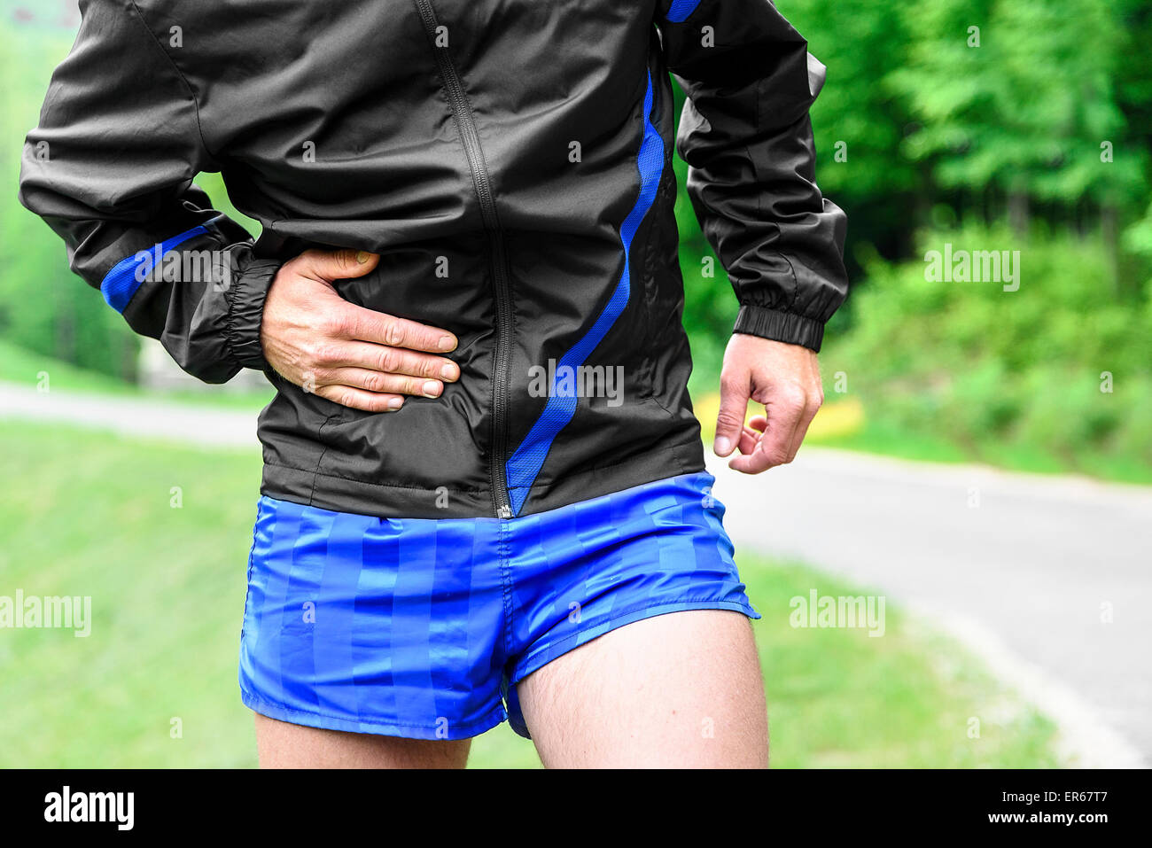 Runner side cramps after running Stock Photo Alamy
