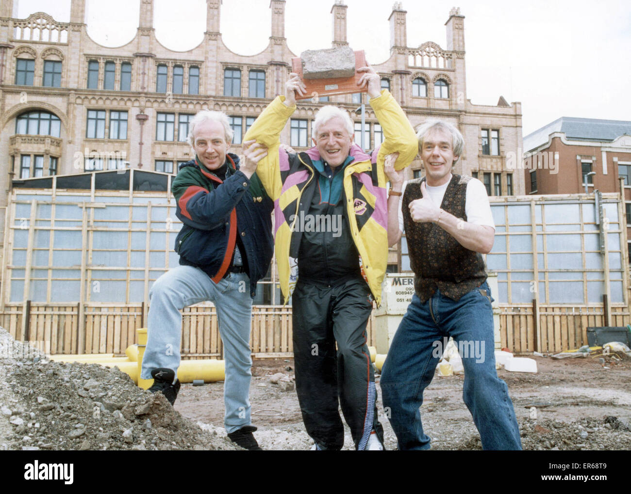 Jimmy Savile (centre) seen here on the site of the Plaza Dance Hall Oxford Street Manchester 15 March 1994 Stock Photo