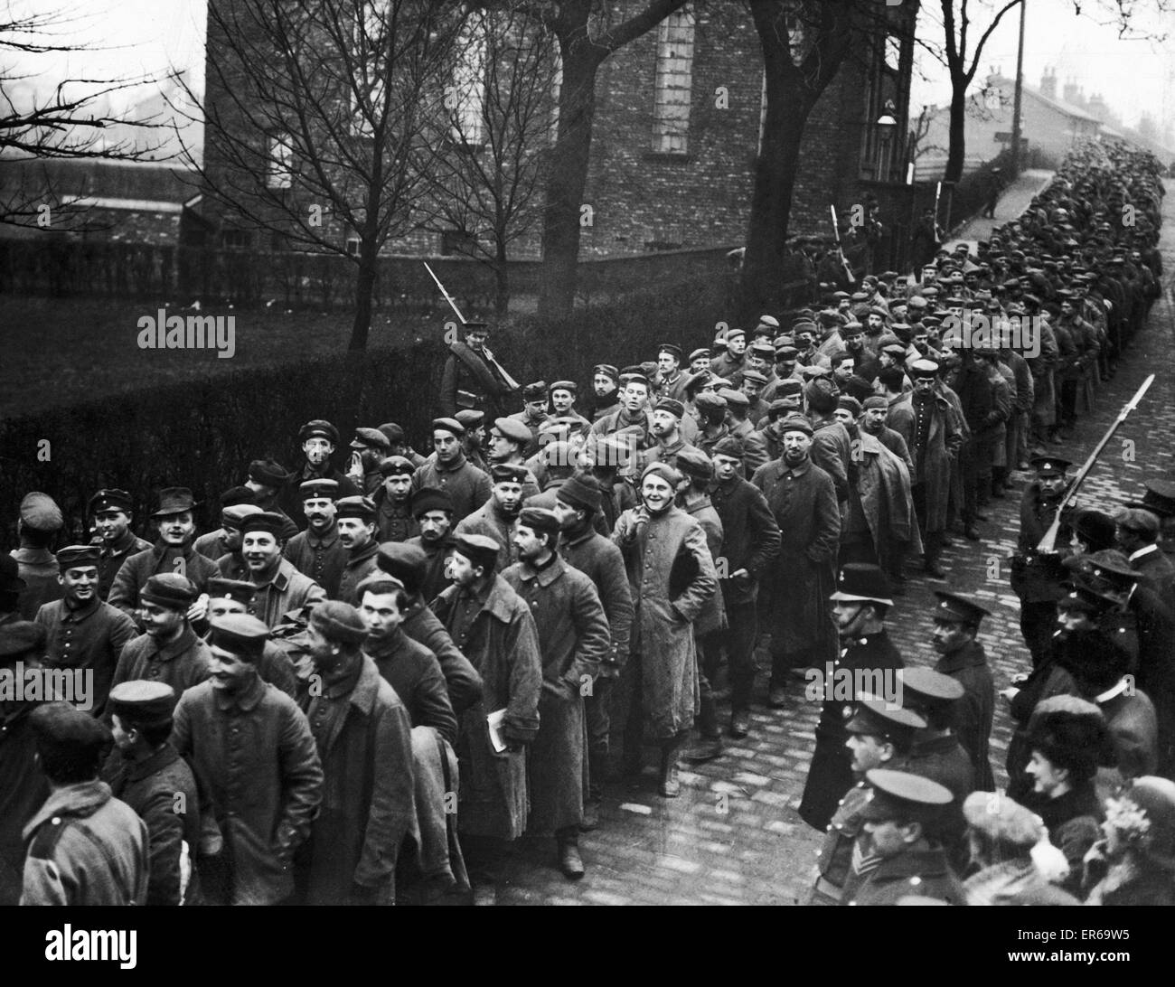 A contingent of German prisoners from Neuve Chapelle seen here  passing through Handforth, Lancashire, on their way to the  Handforth 3, Queen's Ferry Camp prisoner of war camp. Circa March 1915 Stock Photo