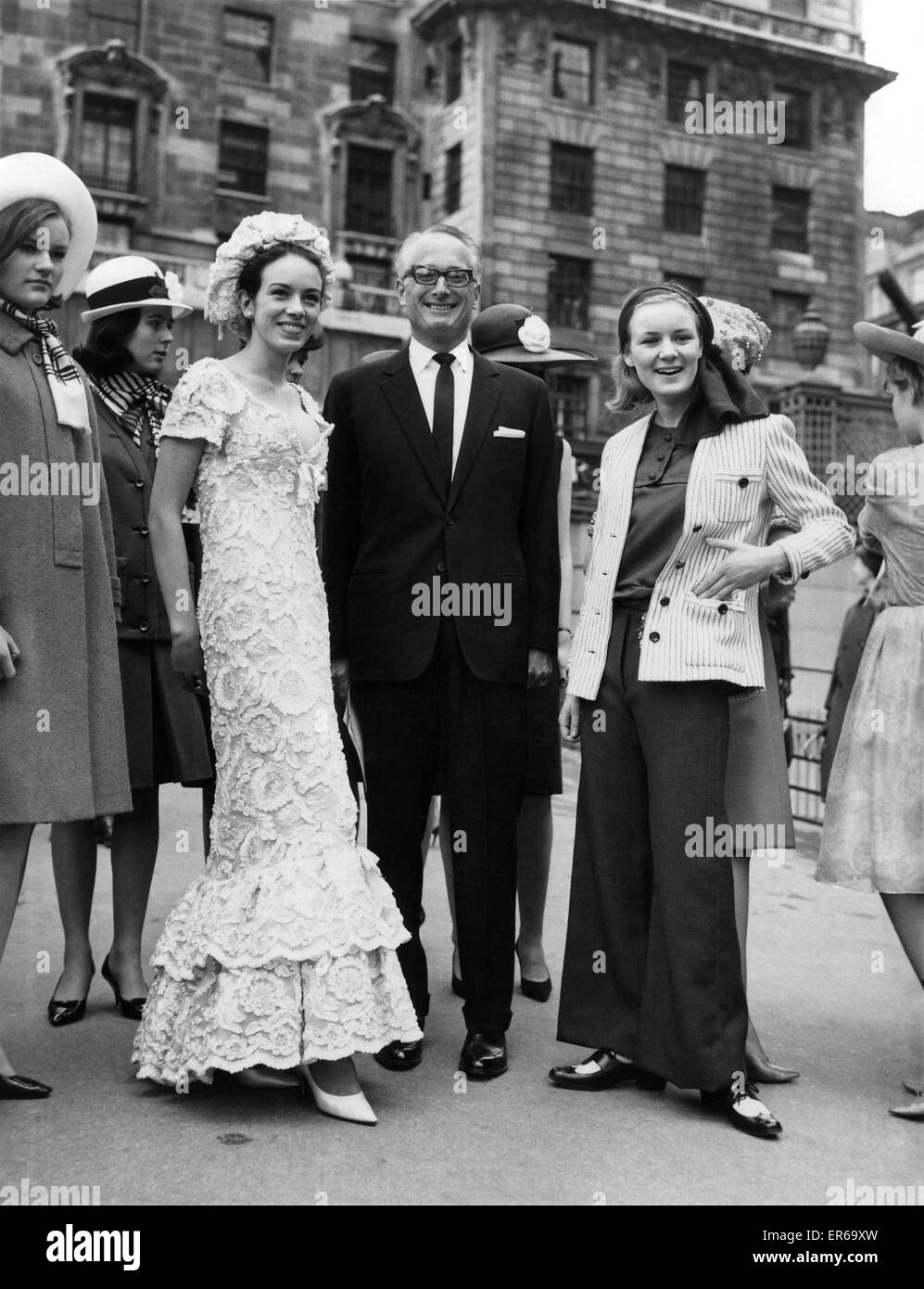 The Duke and the debs went to a fashion show yesterday (Monday 13-4-64). The Duke of Bedford to compare it. The debs, 17-year-old-Jessica Kitson (left), to model that long white lace evening gown, 'Pavillon de la Cascade,” and Frances Taylor modelling 'Ya Stock Photo