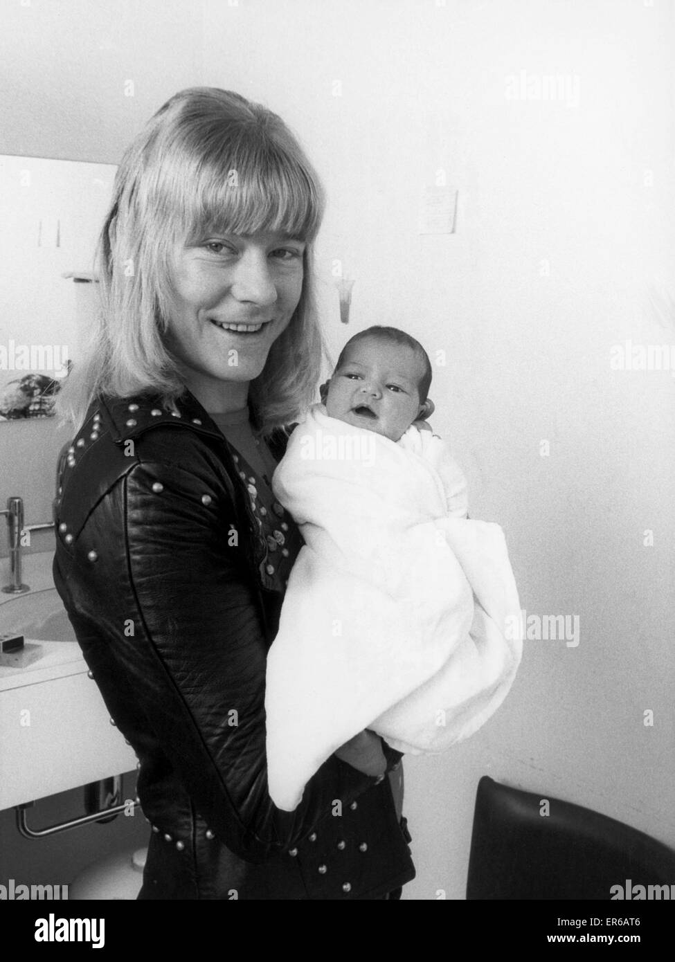 Brian Connolly, lead singer of that chart-busting group The Sweet, is a family man now. And the new pop is clearly proud to present his first-child, Nicola. Brian's 23 year old wife Marilyn gave birth to their 7lb daughter in hospital at Chertsey, Surrey Stock Photo