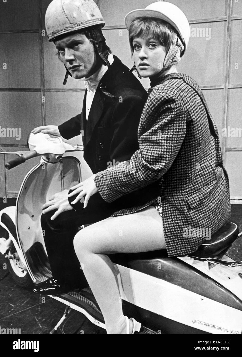 The final scene from the musical 'Quick, Quick, Slow,' the lovers elope on a scooter. Played by Jeffery Shankley as Norman Wentworth and Tina Martin as Linda Bradshaw. 19th August 1969 Stock Photo