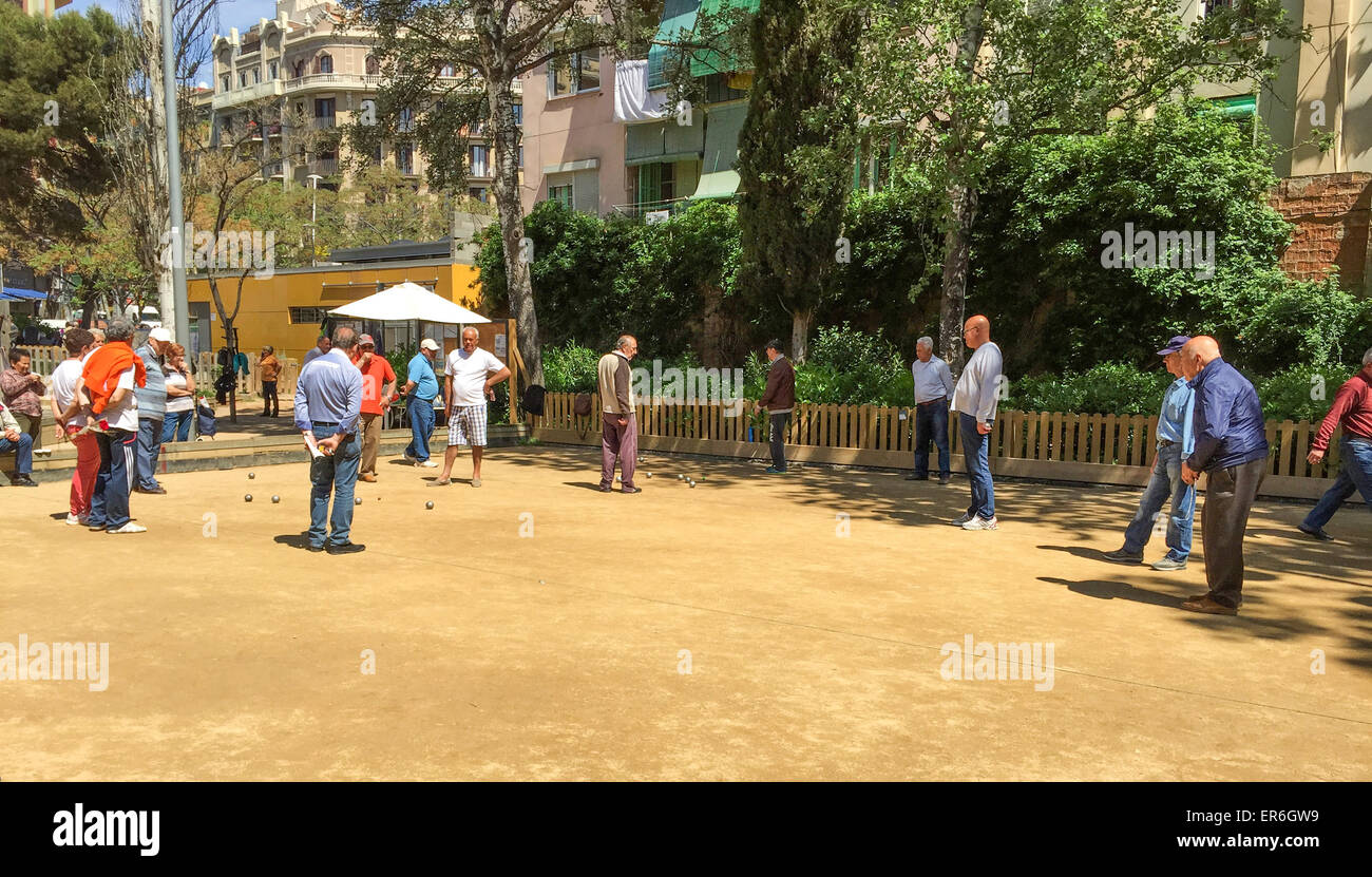 Barcelona street scene of seniors playing boule Stock Photo