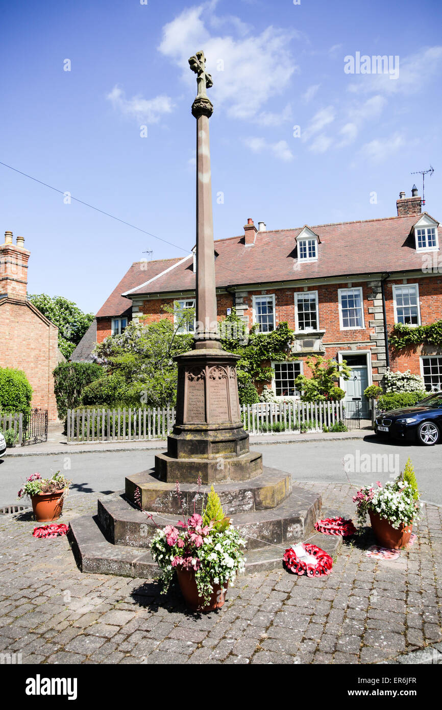 A stone war memorial in an English village Stock Photo