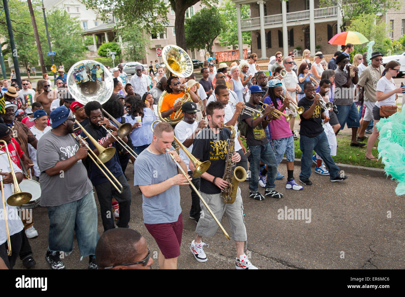 New Orleans, Louisiana - A brass band follows the dancers in the Divine Ladies Social Aid and Pleasure Club's Second Line parade Stock Photo