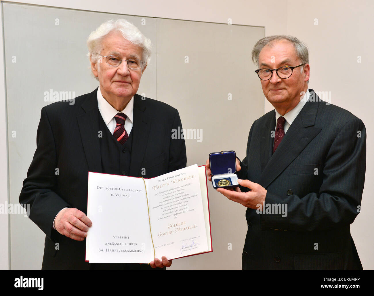 The German philologist Walter Hinderer (L) who teaches in Princeton  receives the golden Goethe medal from the President of the Goethe society,  Jochen Golz, during the 84th general assembly of the Goethe