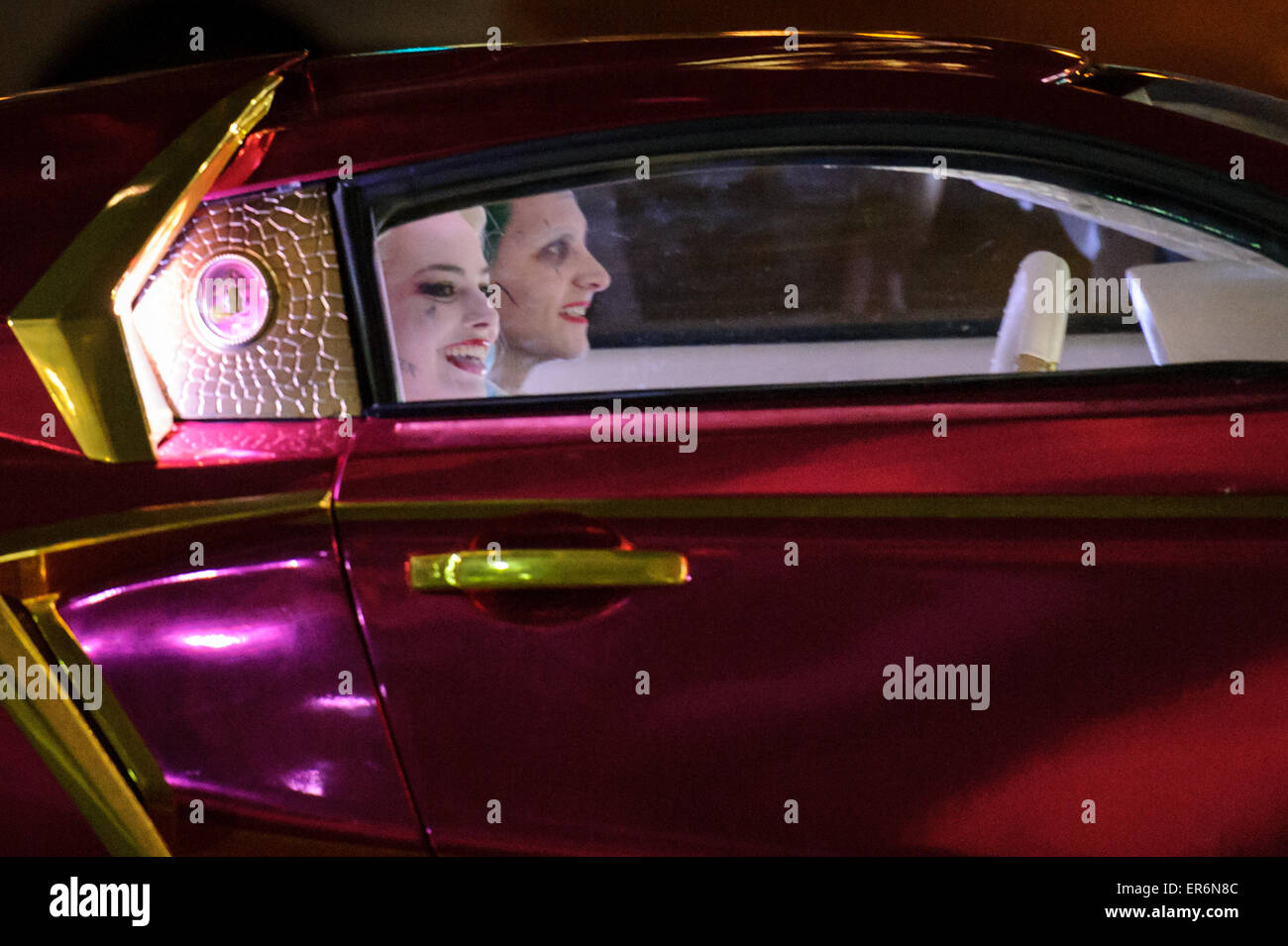 Toronto, Canada. 27th May, 2015. Stunt doubles for Jared Leto's Joker and Margot Robbie's Harley Quinn can be seen in a Vaydor G35 sports car on the movie set for action movie: Suicide Squad in Toronto, Ontario on May 27, 2015. Credit:  Julian Avram/Alamy Live News Stock Photo