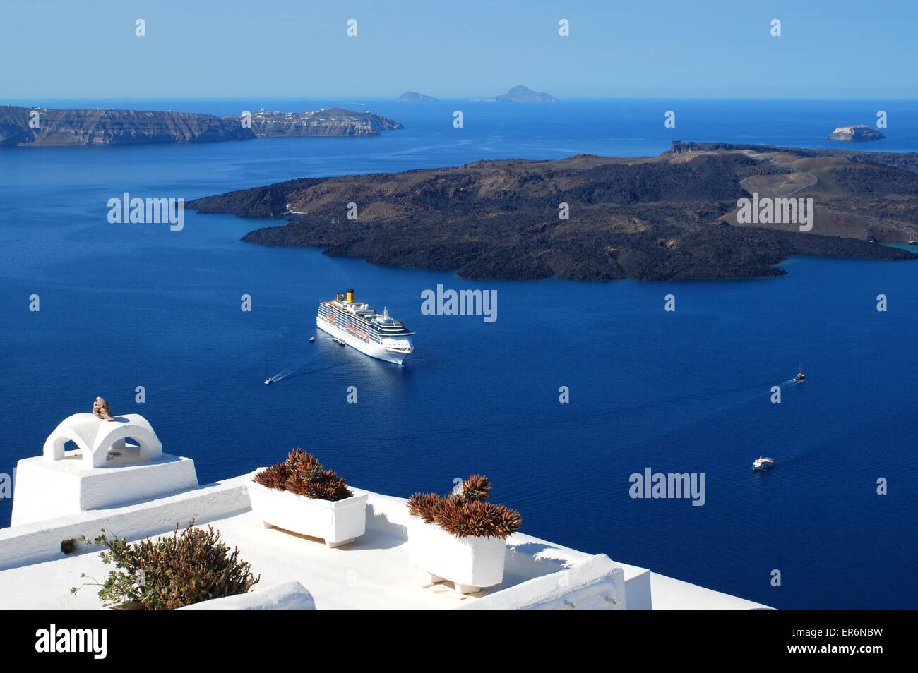 Cruise ship in the caldera of the Greek Island of Santorini, Greece Stock Photo