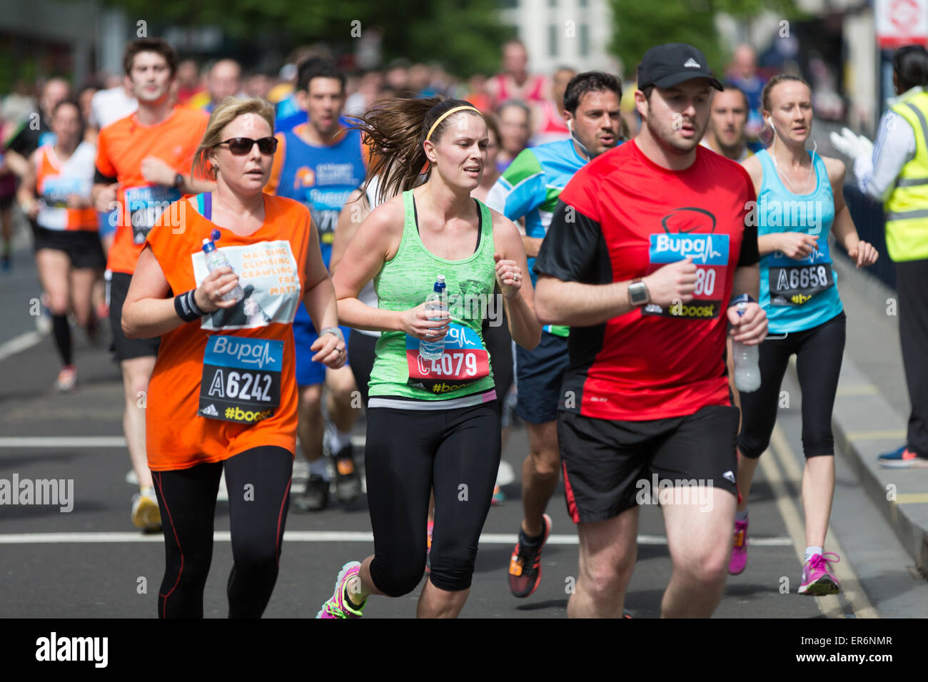 Competitors running at the Bupa London 10,000 run on Monday 25th May 2015 Stock Photo