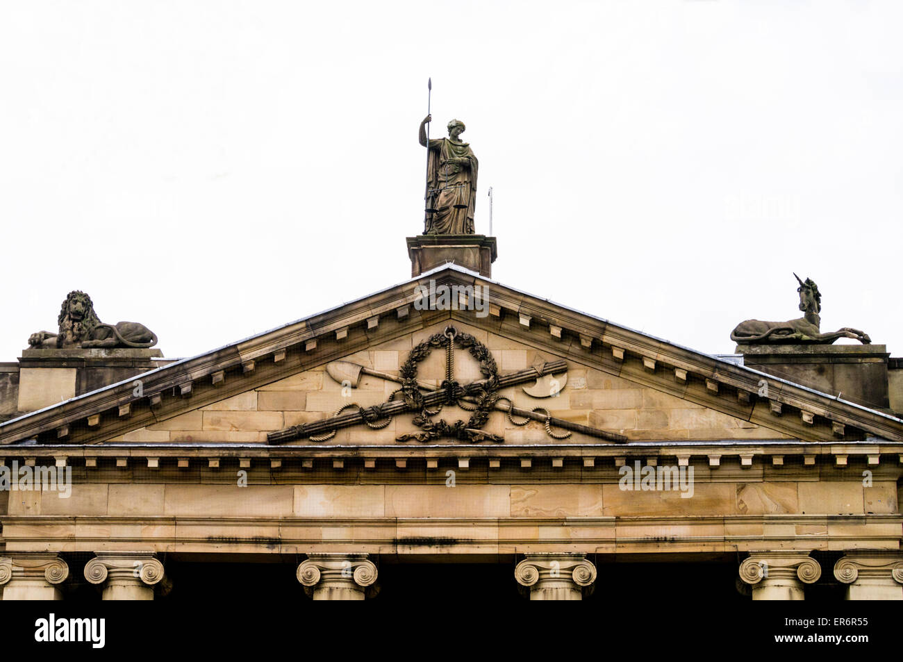Statues representing justice on the roofline above the entrance to York Crown Court, City of York, England, UK Stock Photo
