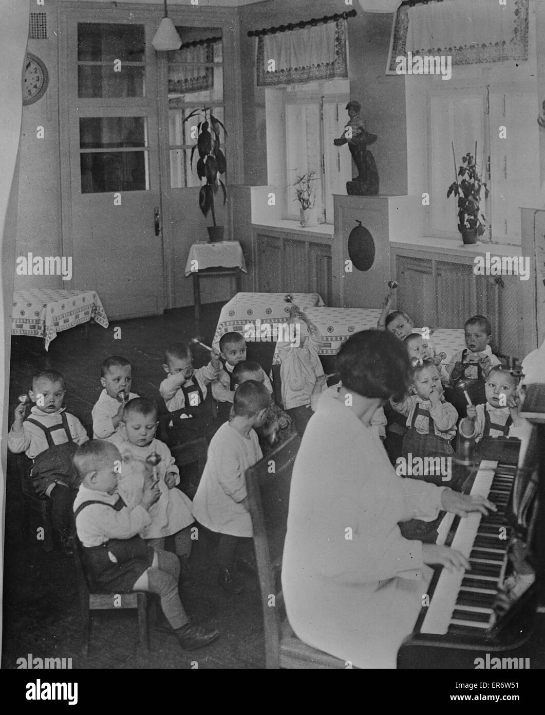 Nursery school children having music and rhythms in the USSR Stock Photo