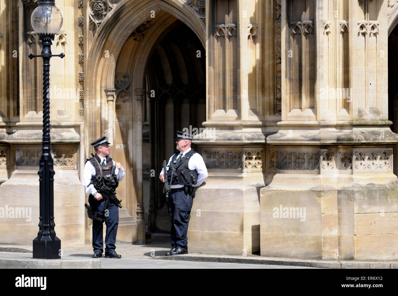 London, England, UK. Armed police on duty at the Houses of Parliament, Westminster Stock Photo