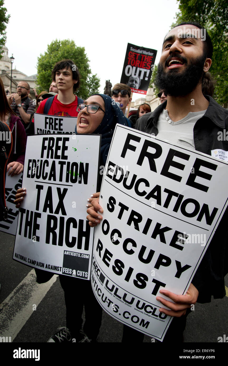 London Anti Austerity Protest. Whitehall. Students hold placards saying 'Free education. Strike, occupy, resist'. Stock Photo