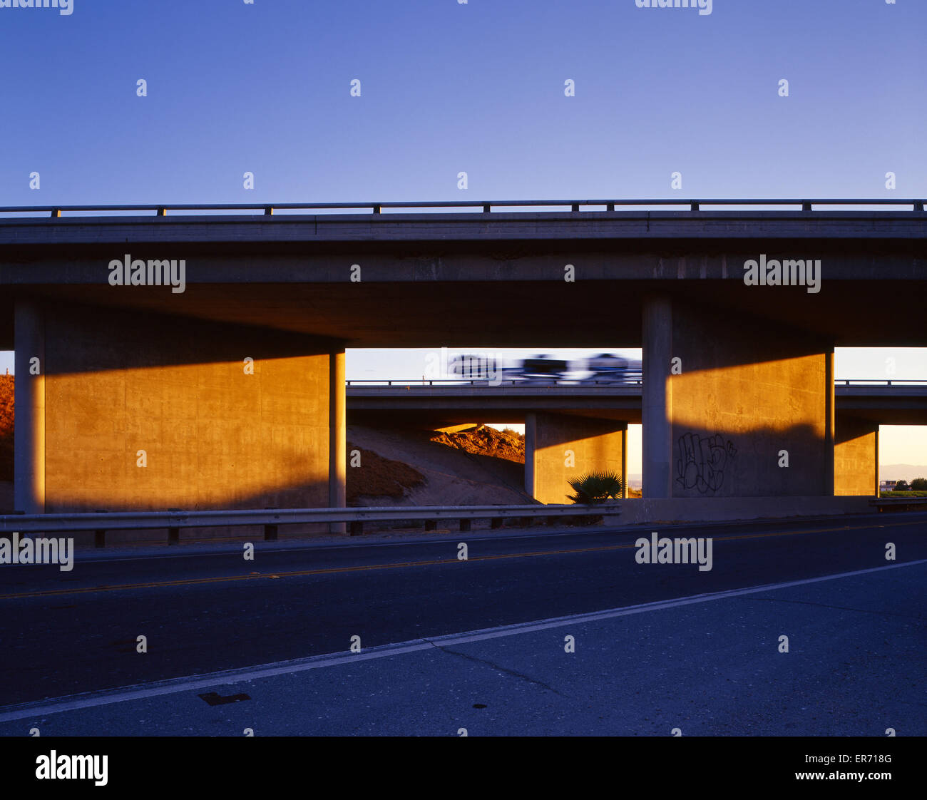 Highway overpass at sunset Stock Photo