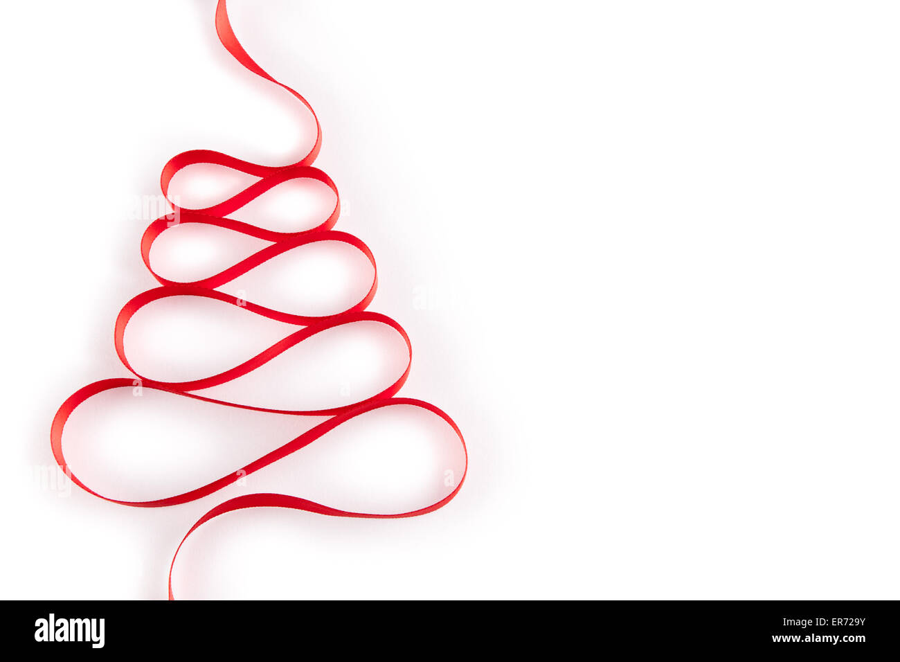 Christmas tree from red ribbon on white background Stock Photo - Alamy