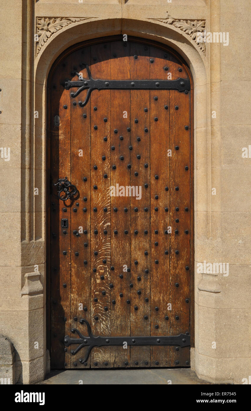 wooden door with studs and iron fittings, Oxford, England Stock Photo