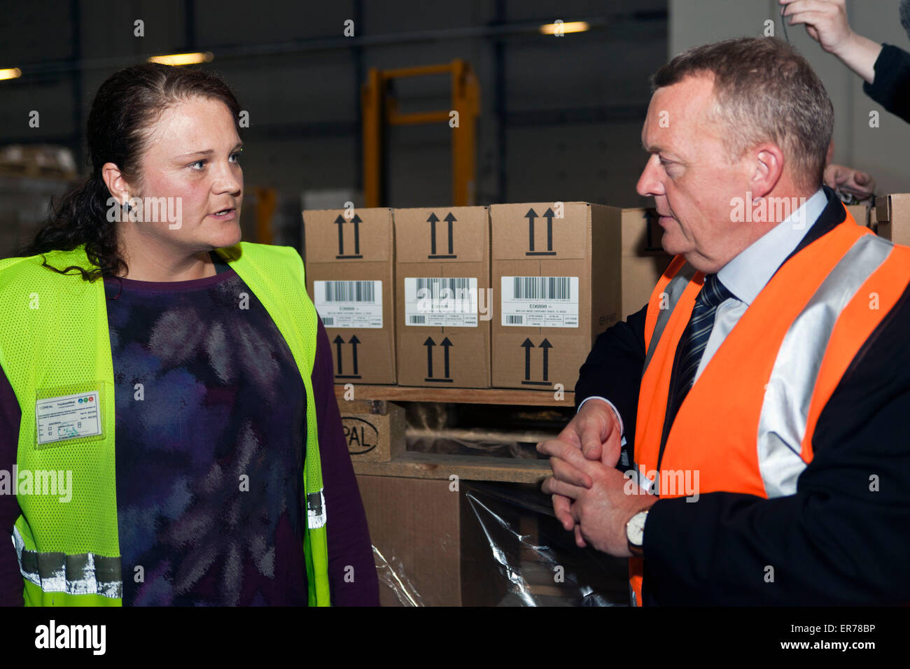 Greve, Denmark, May 28th, 2015: Opposition leader Lars Lokke Rasmussen (R) (Venstre, read: The Liberal) visits L'Oréal’s Nordic distribution center and speaks to foreign workers. Here he met Mrs. Joanna Malecka from Poland. She works works as forklift driver in the warehouse Credit:  OJPHOTOS/Alamy Live News Stock Photo