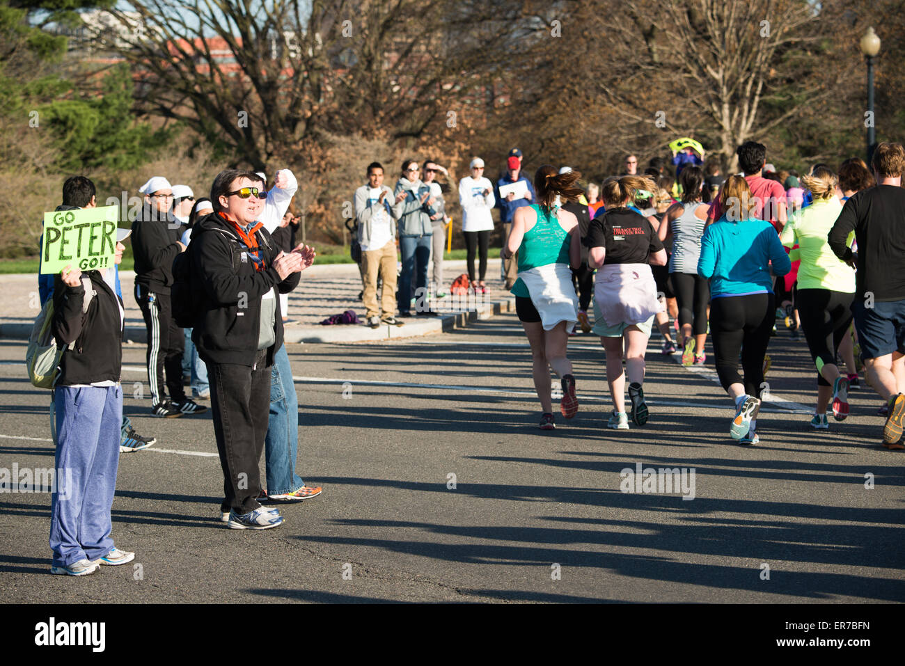WASHINGTON DC, United States — Spectators cheer on runners in the