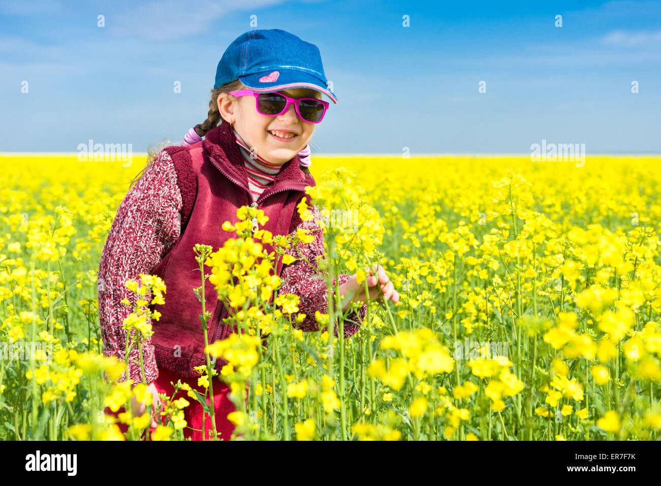 girl in a yellow field of rape Stock Photo - Alamy