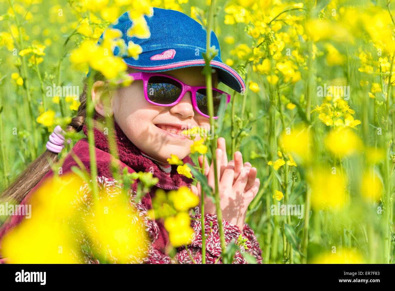 girl in a yellow field of rape Stock Photo - Alamy