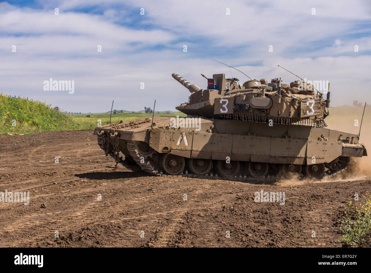 Israel. A Merkava Mk. IV tank maneuvers in the Golan heights. Stock Photo