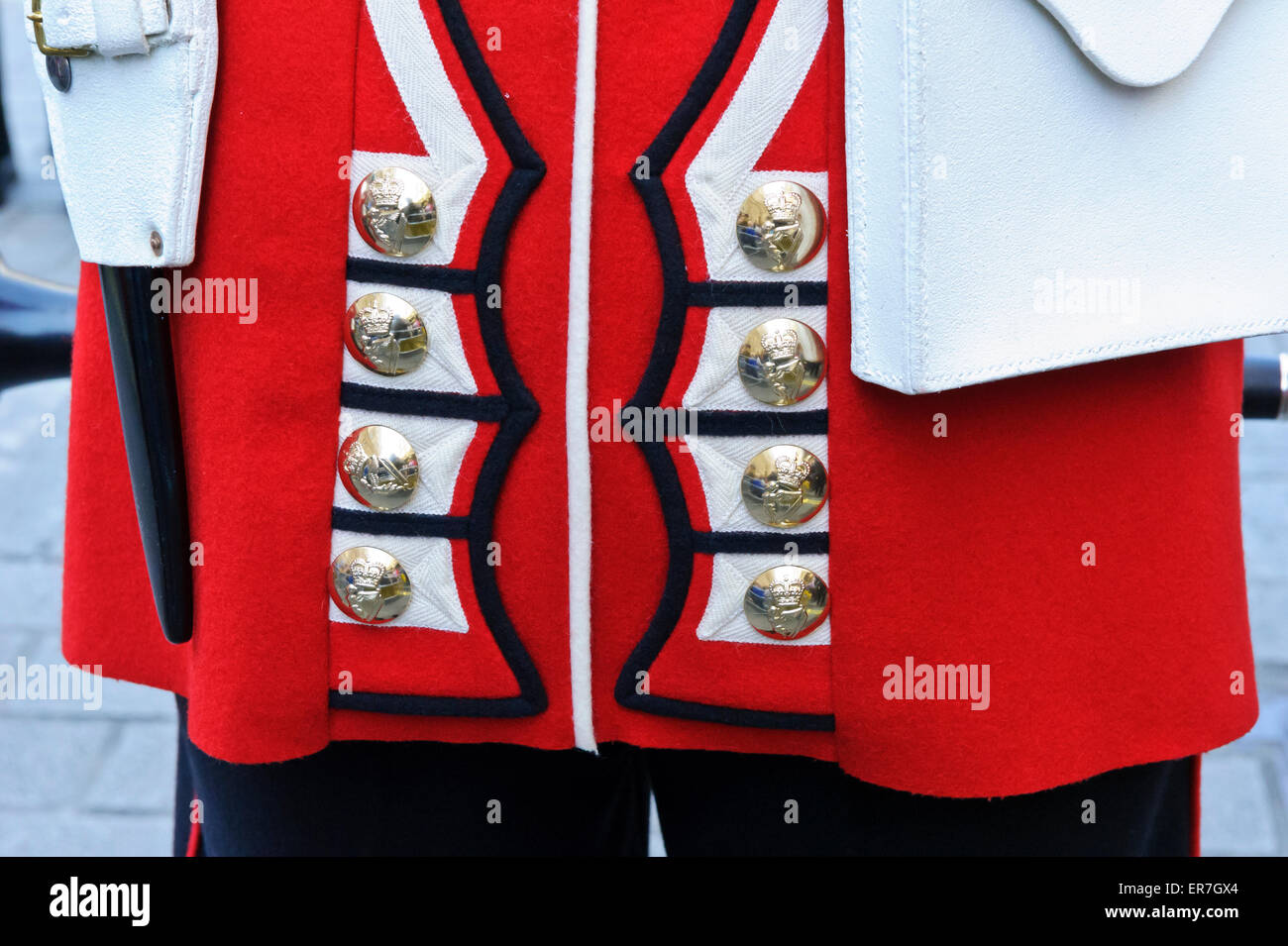 Closeup of the back of the Queen's Guard uniform with the ornate golden  buttons and knife, London, England, United Kingdom Stock Photo - Alamy
