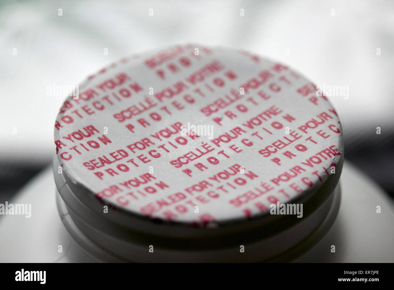 sealed tamper proof top on a bottle of pills Stock Photo