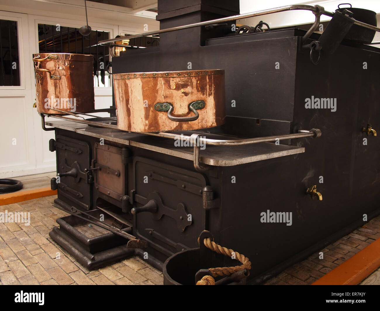 A cooking range in the galley of HMS Warrior in Portsmouth Historic Dockyard, Hampshire, England Stock Photo