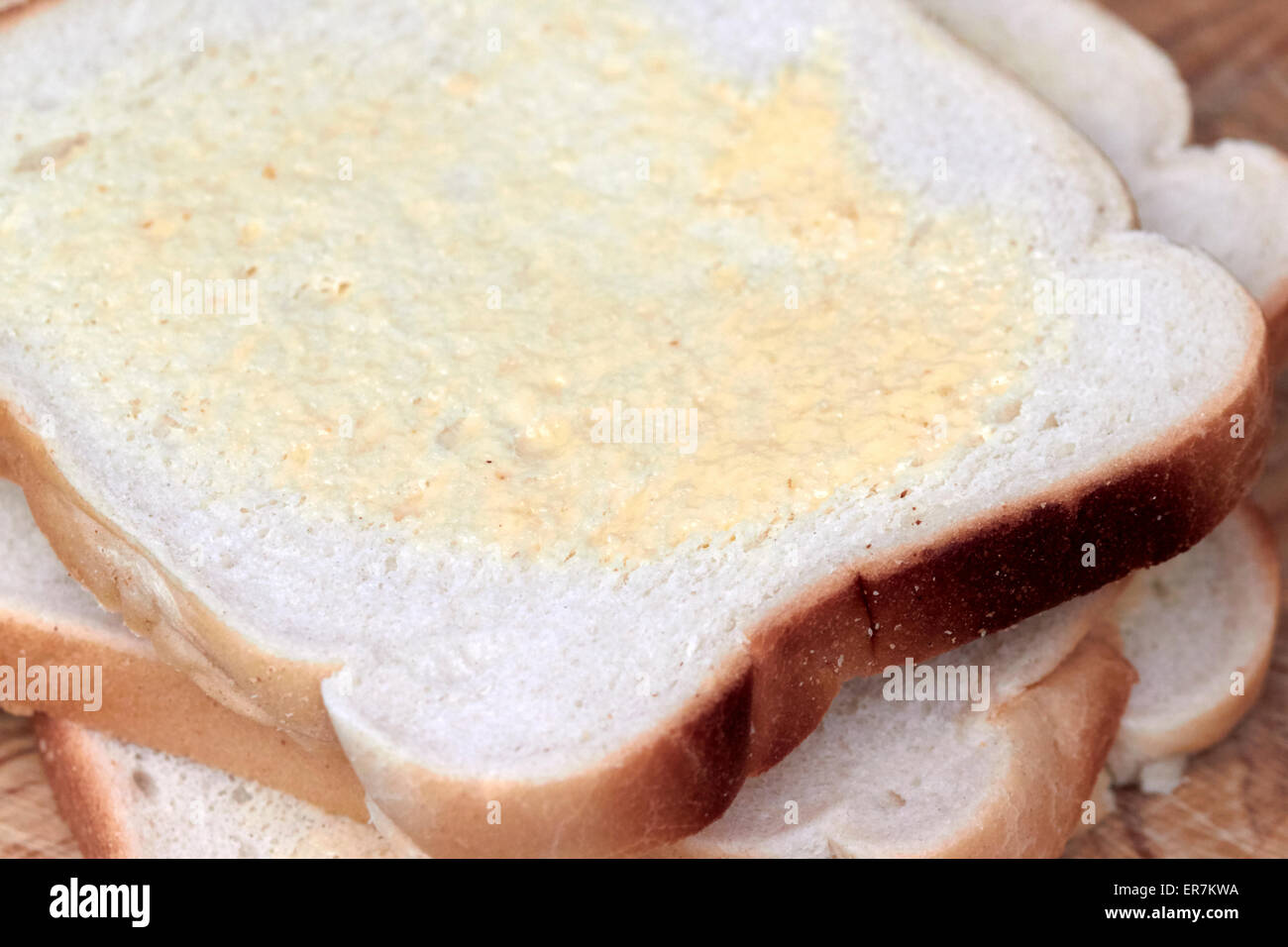 slices of white buttered bread Stock Photo Alamy