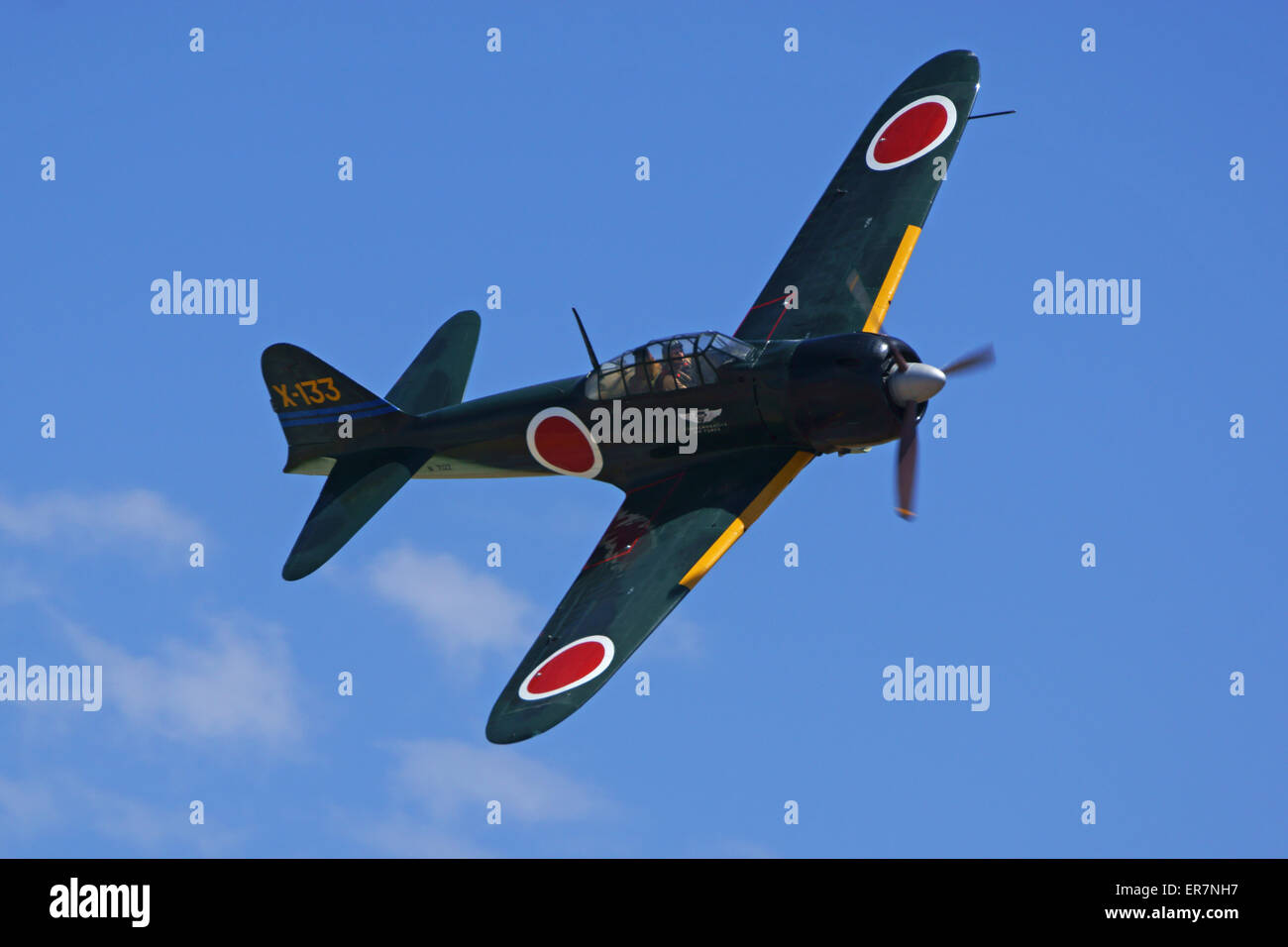 WWII Vintage Japanese Zero fighter airplane flying at 2015 Planes of Fame Air Show Stock Photo