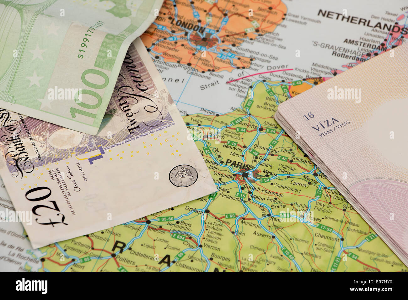 Map, euro and pounds money and a passport. Concept of Europe travel