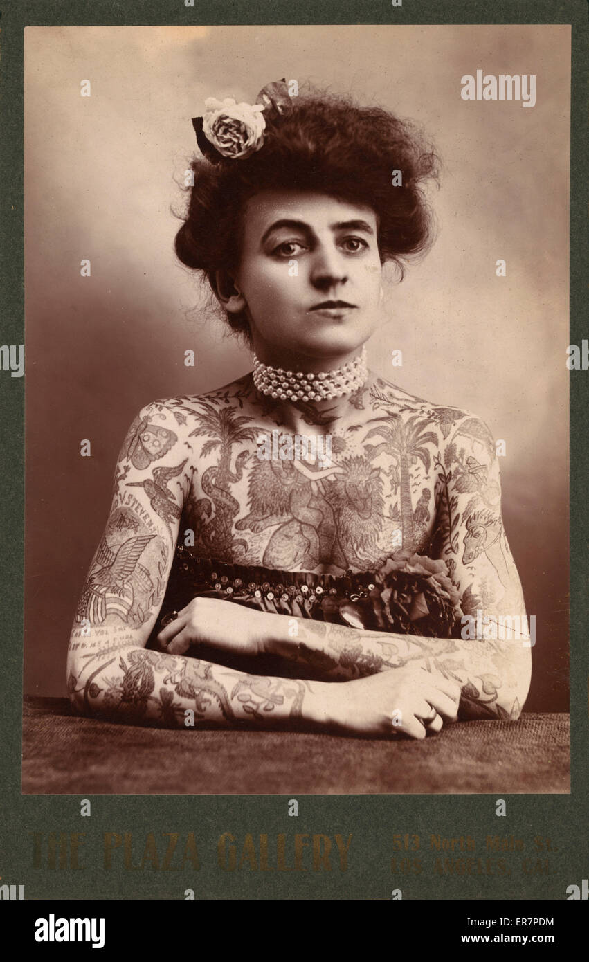 Portrait of a woman showing images tattooed or painted on he Stock Photo