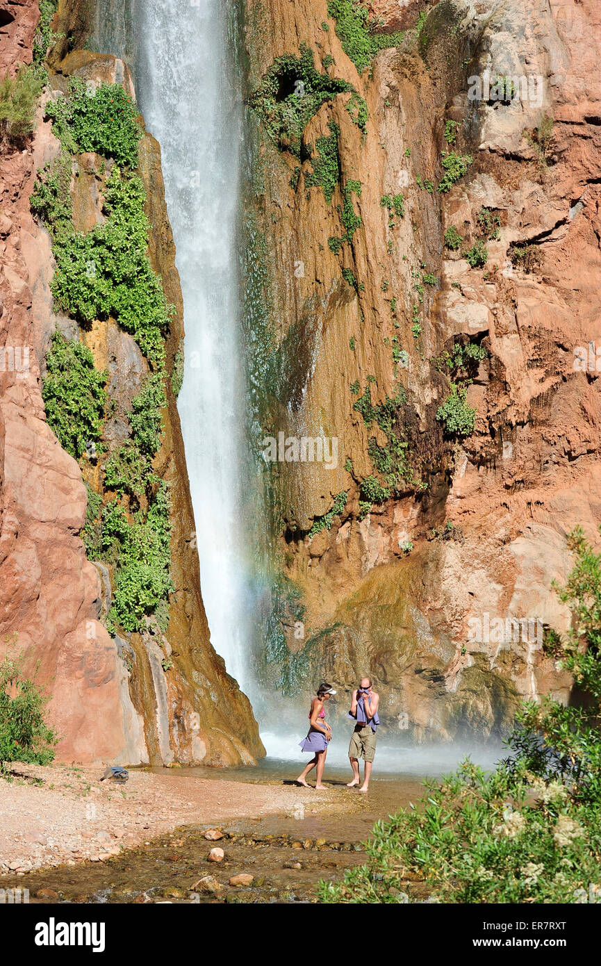 Hikers swim in the pool below 180foot Deer Creek Falls in the Grand