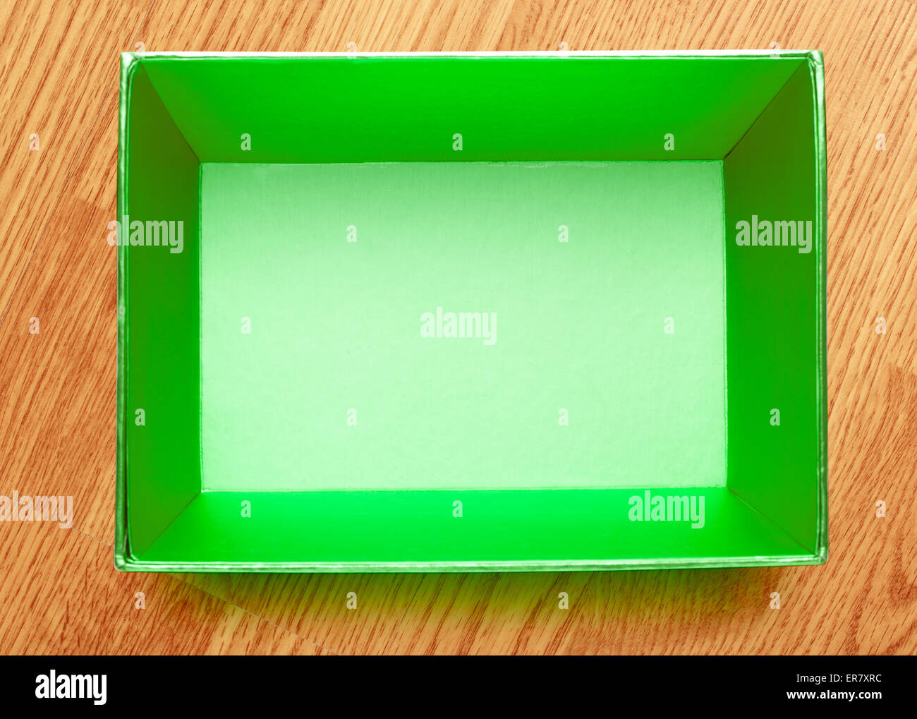 Empty open square box on wooden background Stock Photo